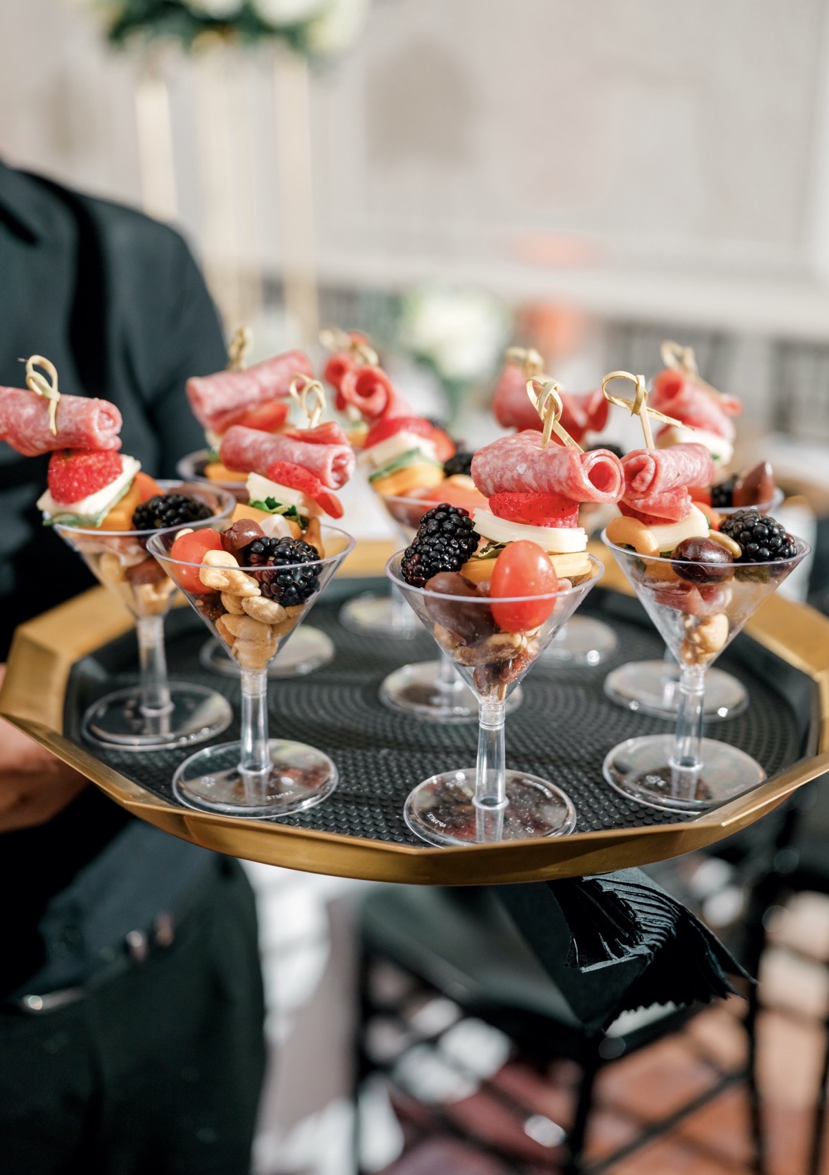 Passed appetizer bites served on a gold tray at a wedding at The Gunter Hotel