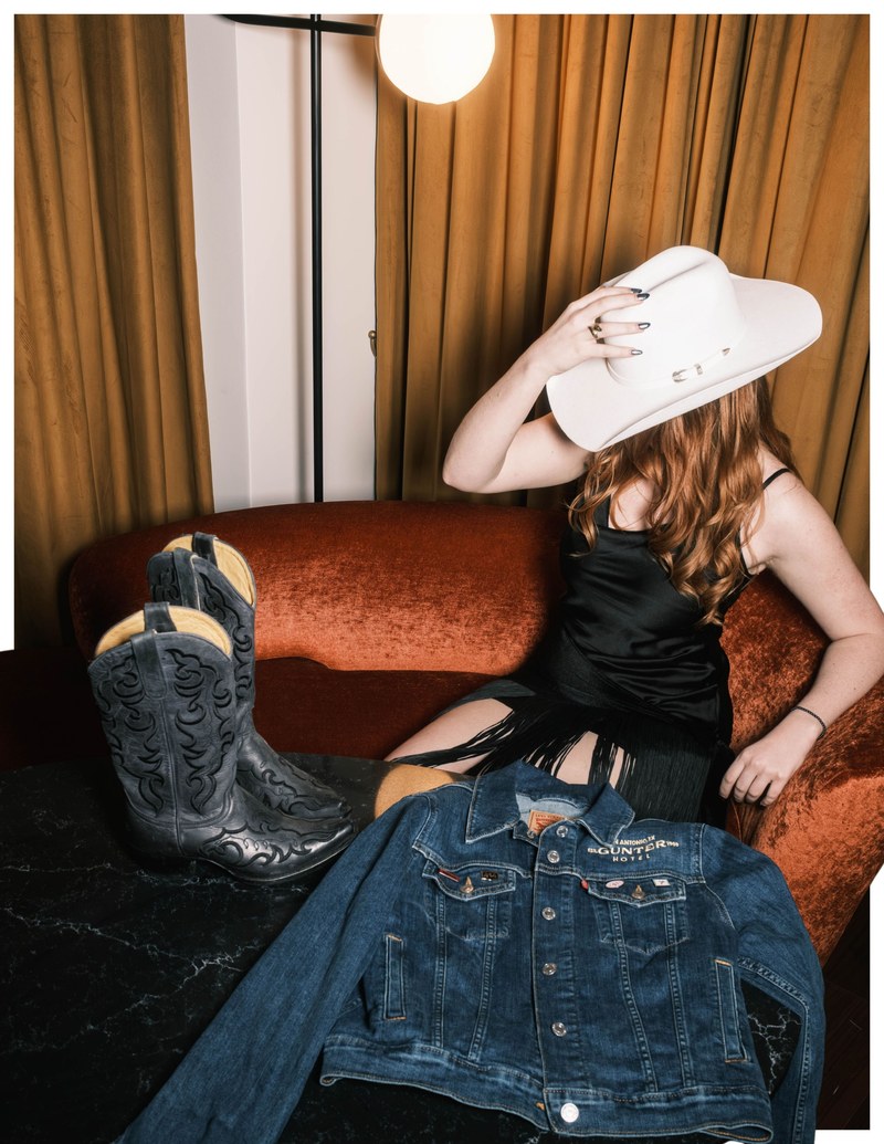Western-inspired style at The Gunter Hotel: cowboy boots, hat, and a Gunter Hotel denim jacket