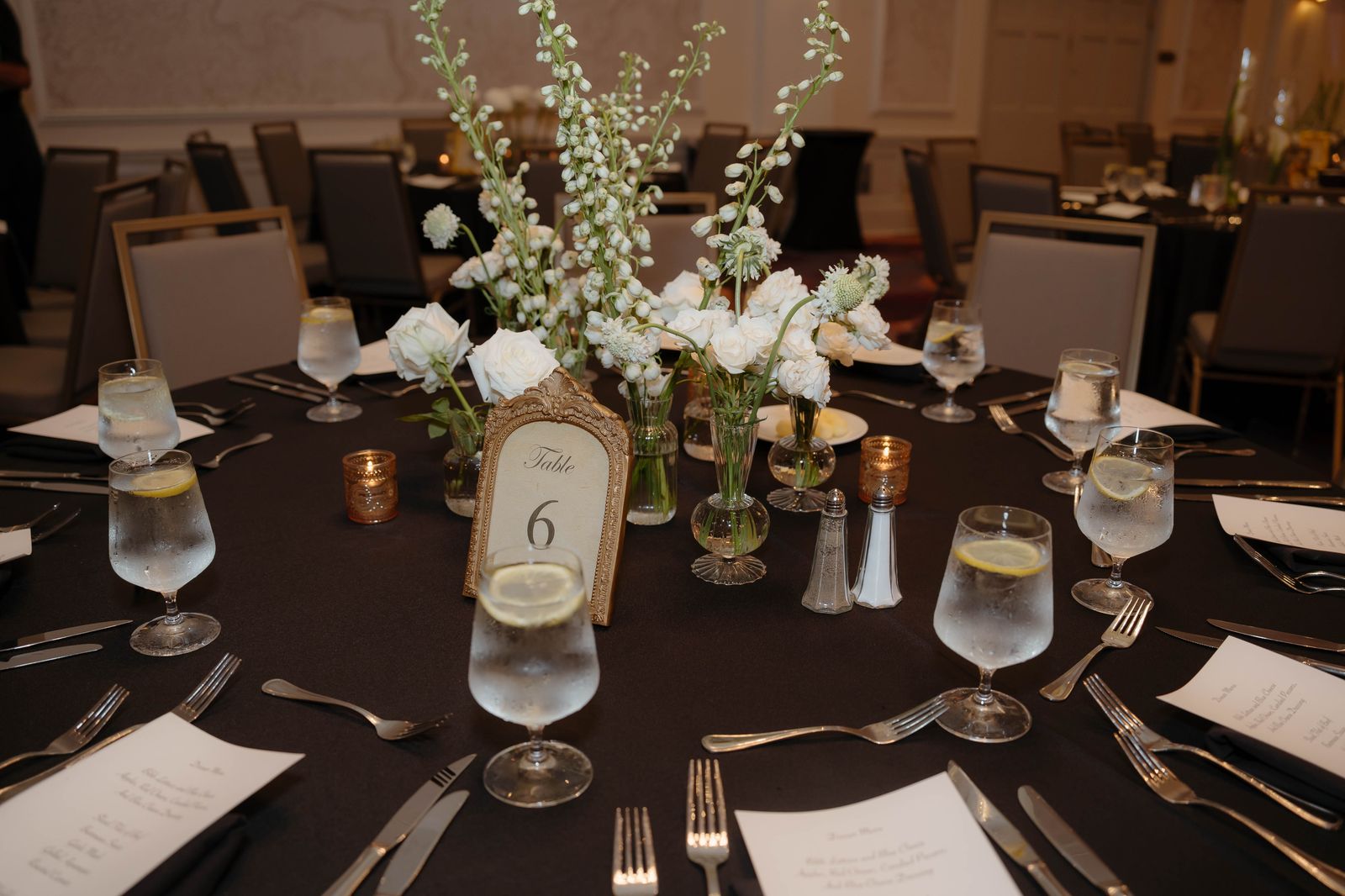 Reception table set with white florals and candlelight
