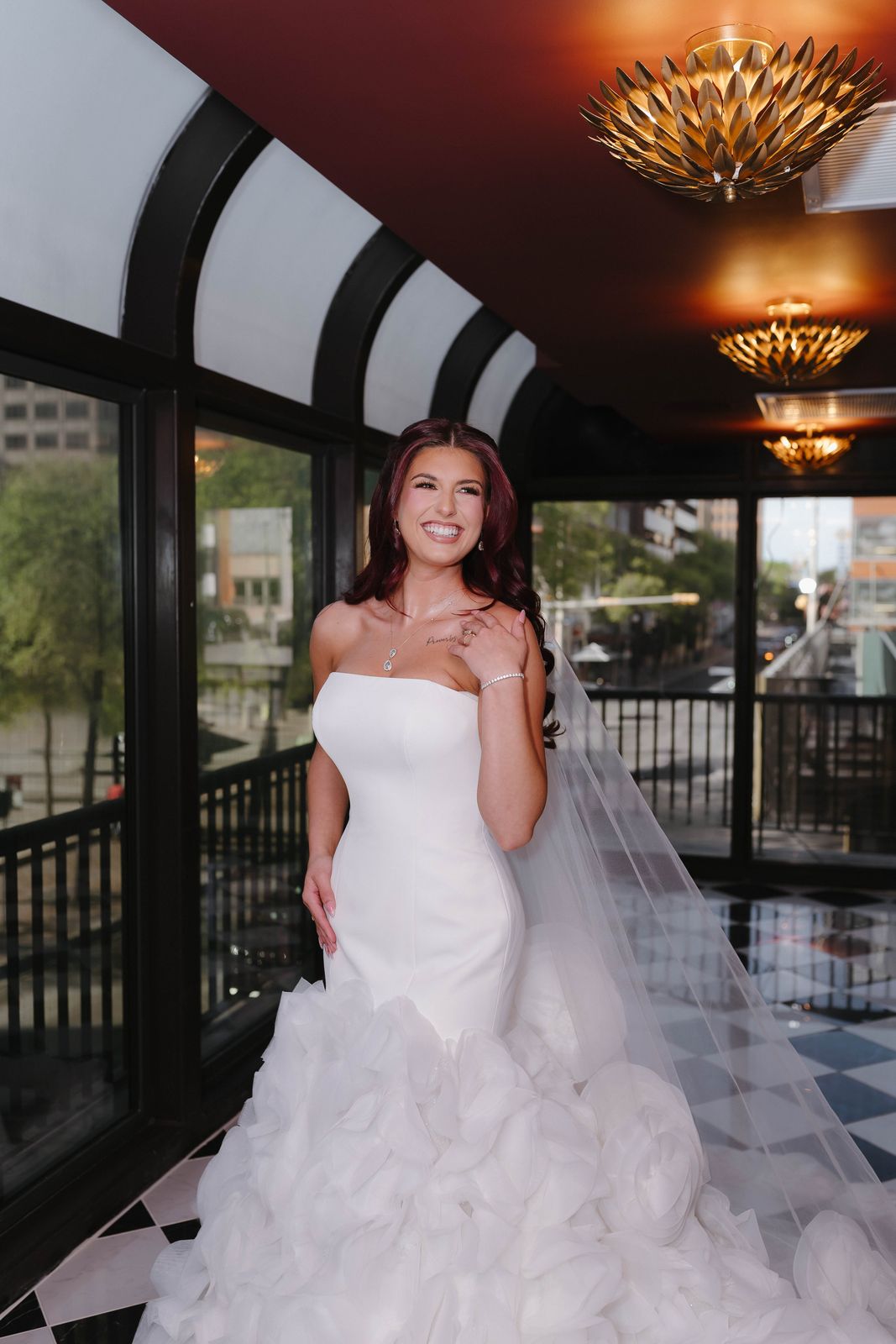 Bride in the chandelier-lit Terrace overlooking downtown San Antonio