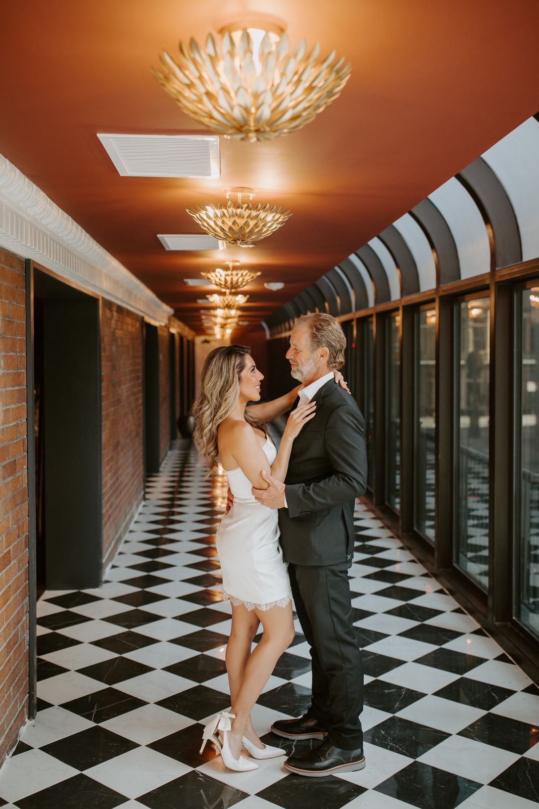 Couple's first dance in the checkerboard-tiled Terrace